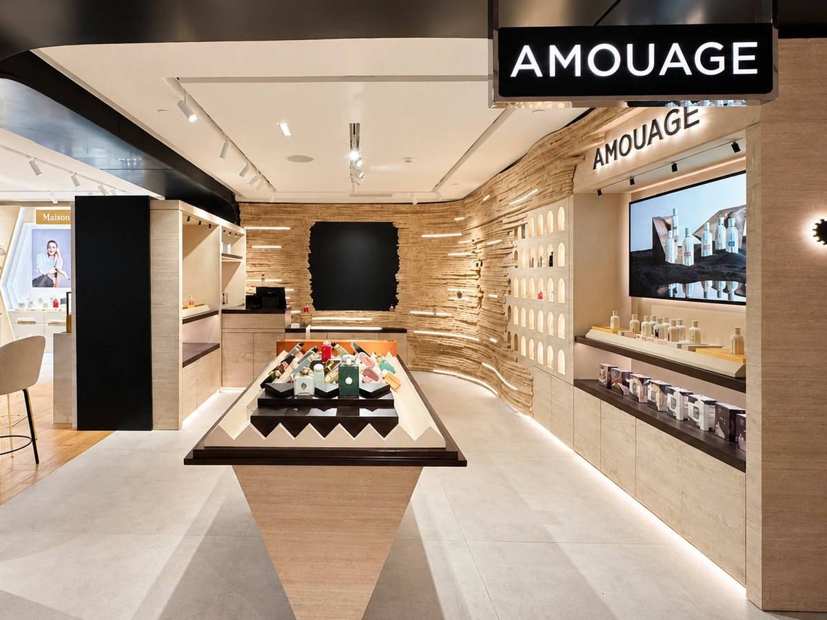 Amouage boutique carved travertine wall and millwork fit-out by SignWorks