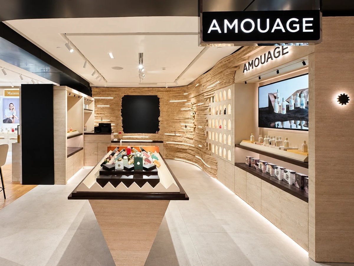 Amouage boutique carved travertine wall and millwork fit-out by SignWorks